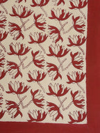 Close-up of red floral jaal hand block print on organic cotton bed sheet | Myyra Jaipur