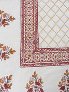 Close-up of maroon and gold hand block print on organic cotton bed cover | Myyra Jaipur