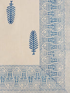 Close-up of blue leaf and fish hand block print on cotton bed sheet | Myyra Jaipur