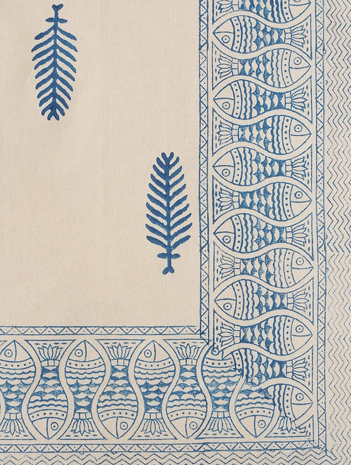 Close-up of blue leaf and fish hand block print on cotton bed sheet | Myyra Jaipur