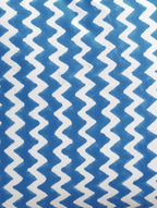 Close-up of blue zigzag hand block print on organic cotton cushion cover | Myyra Jaipur