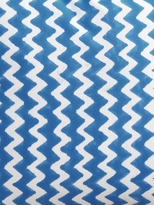 Close-up of blue zigzag hand block print on organic cotton cushion cover | Myyra Jaipur