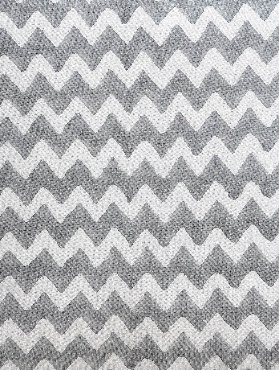 Close-up of grey zigzag hand block print on organic cotton cushion cover | Myyra Jaipur