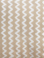 Close-up of beige zigzag hand block print on organic cotton cushion cover | Myyra Jaipur
