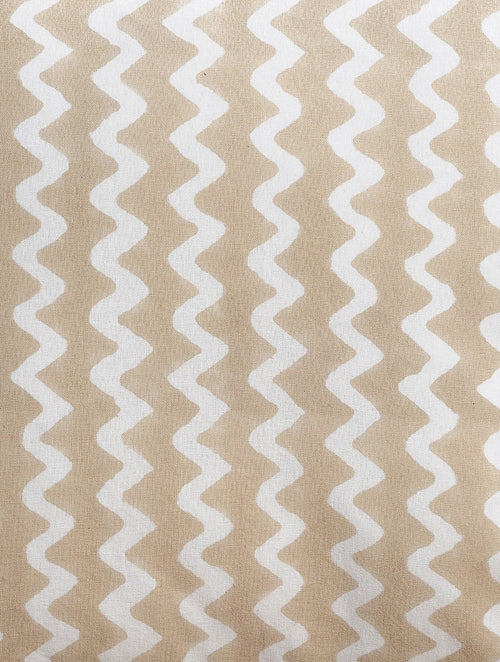 Close-up of beige zigzag hand block print on organic cotton cushion cover | Myyra Jaipur