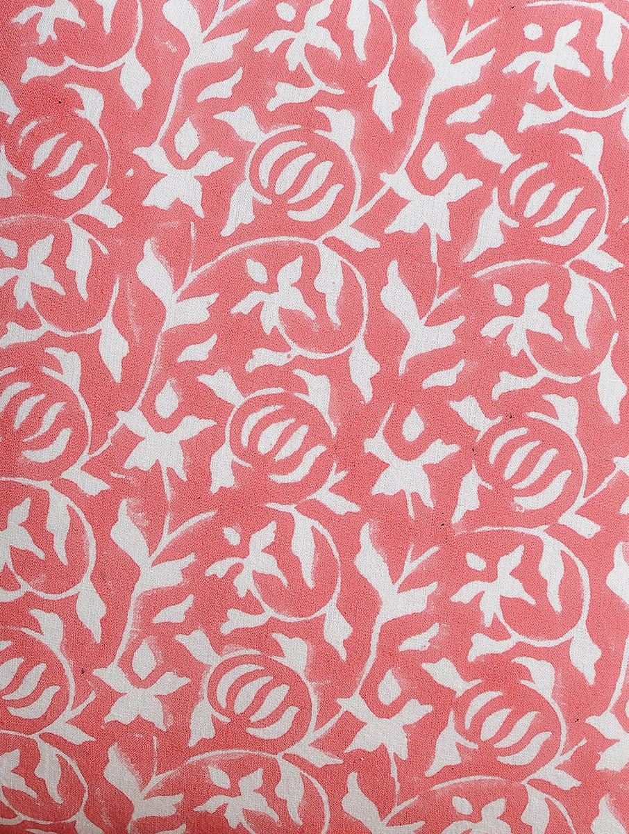 Close-up of peach hand block print on organic cotton cushion cover | Myyra Jaipur