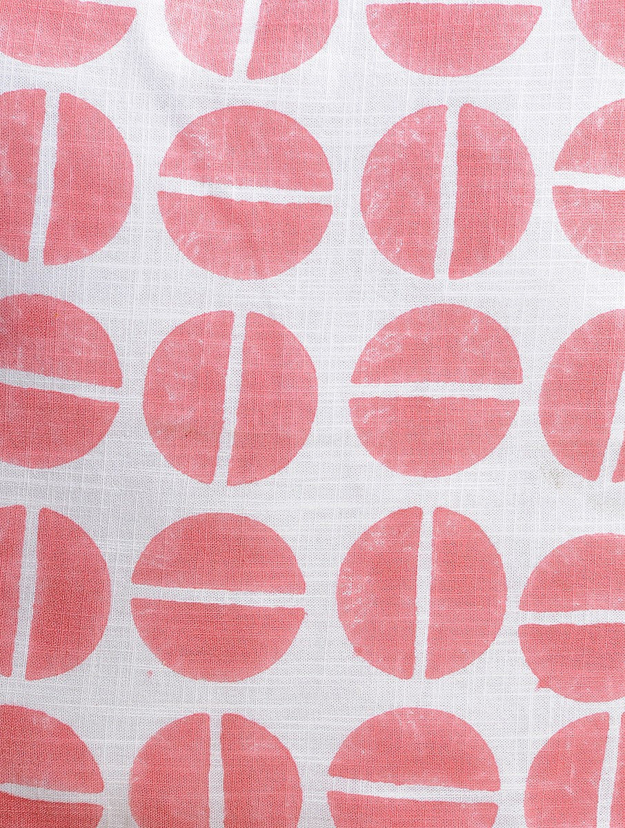 Close-up of peach hand block print on organic cotton cushion cover | Myyra Jaipur