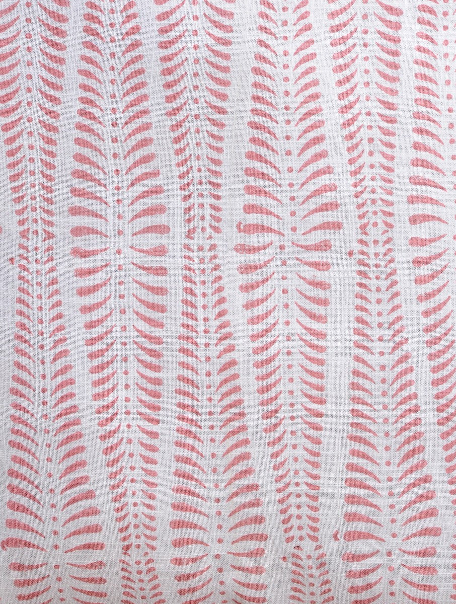 Close-up of peach hand block print on organic cotton cushion cover | Myyra Jaipur